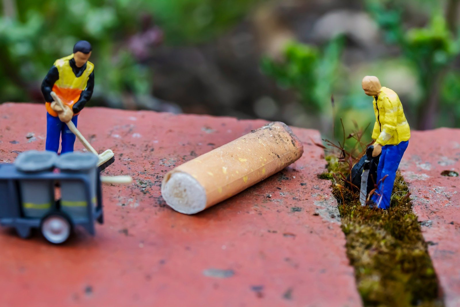 man in black and yellow jacket sitting on blue chair
